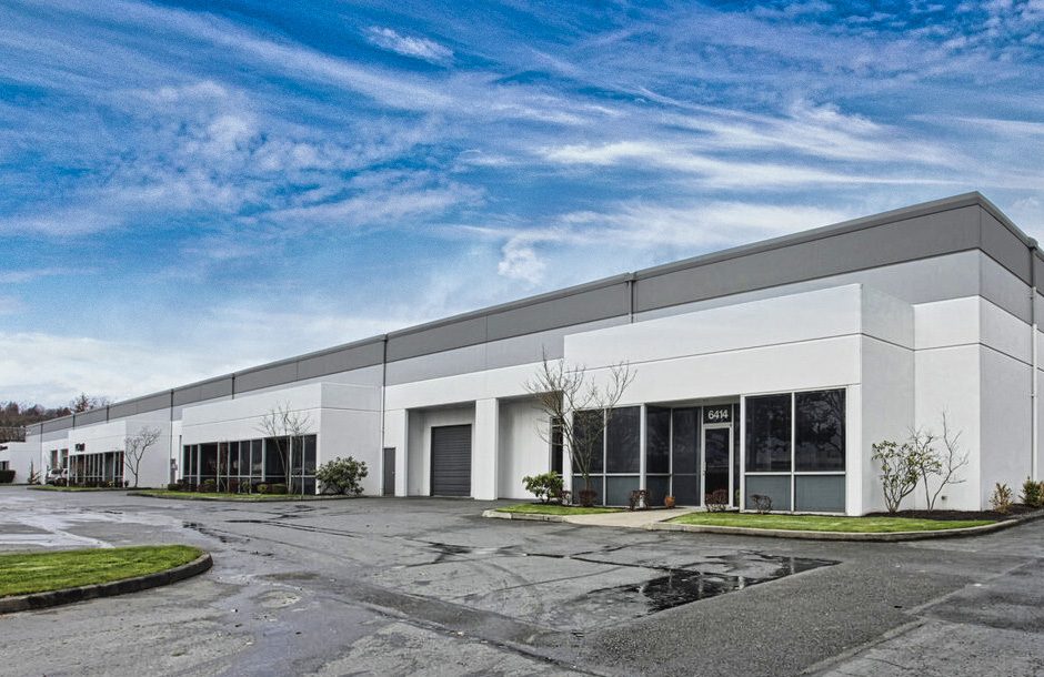 Single-story industrial warehouse building leased by EC Power Systems